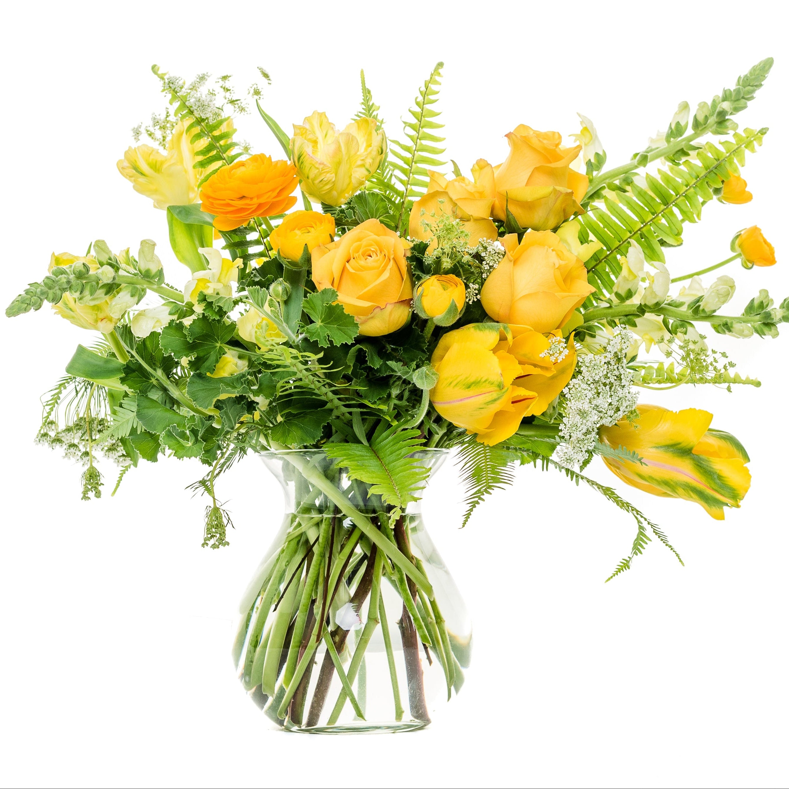 A vibrant yellow and green floral bouquet in a clear glass vase, isolated on a solid white background.